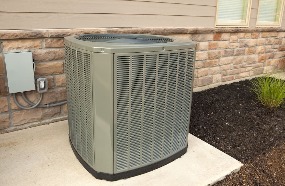 outdoor air conditioning unit on the side of a house