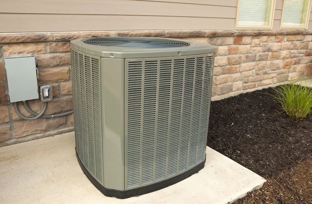 outdoor air conditioning unit on the side of a house
