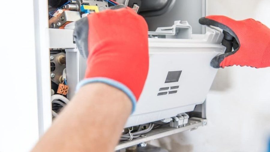 Technician conducting furnace repair