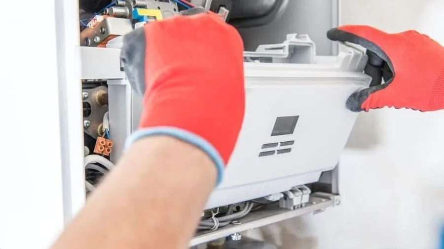 Technician conducting furnace repair